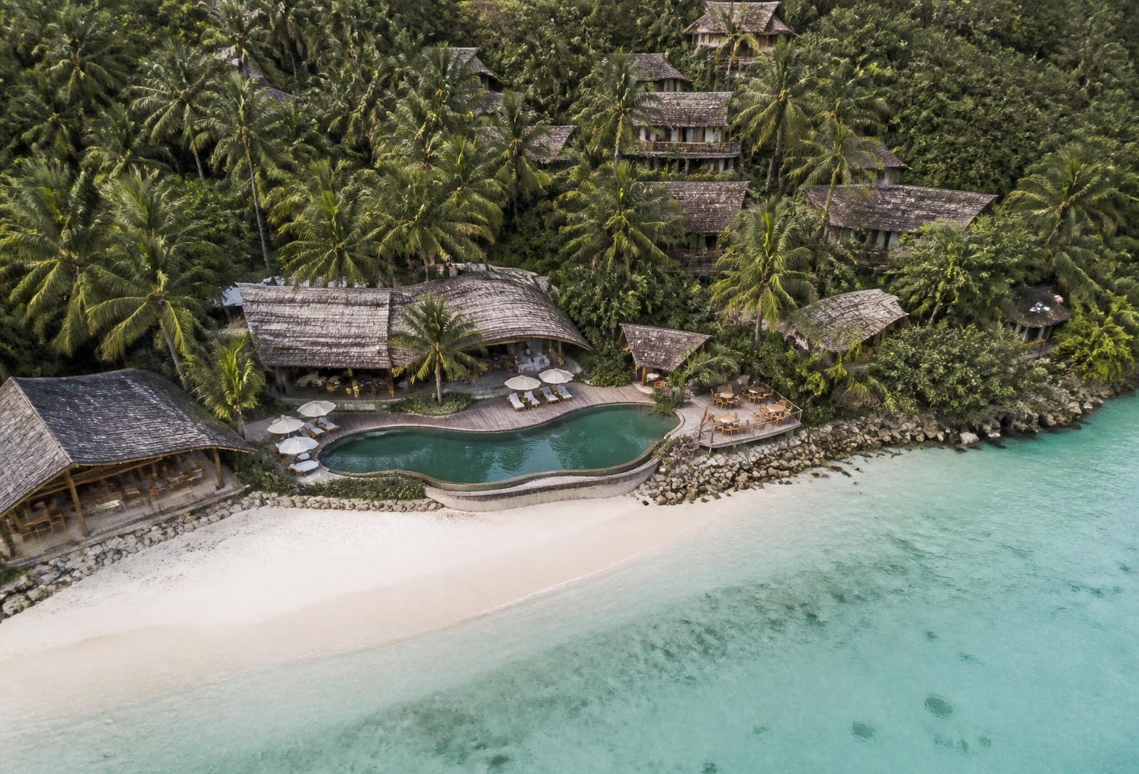 Natural tropical resort with wooden architecture by the sea